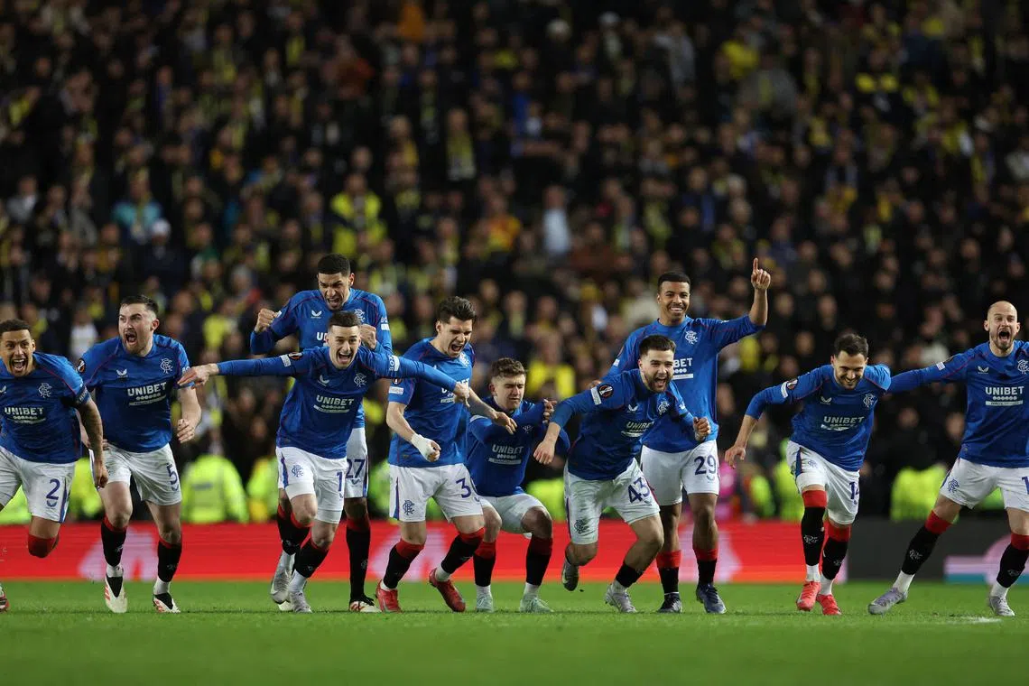 Soccer Football - Europa League - Round of 16 - Second Leg - Rangers v Fenerbahce - Ibrox, Glasgow, Scotland, Britain - March 13, 2025 Rangers players celebrate after winning the penalty shoot-out REUTERS/Russell Cheyne/File Photo