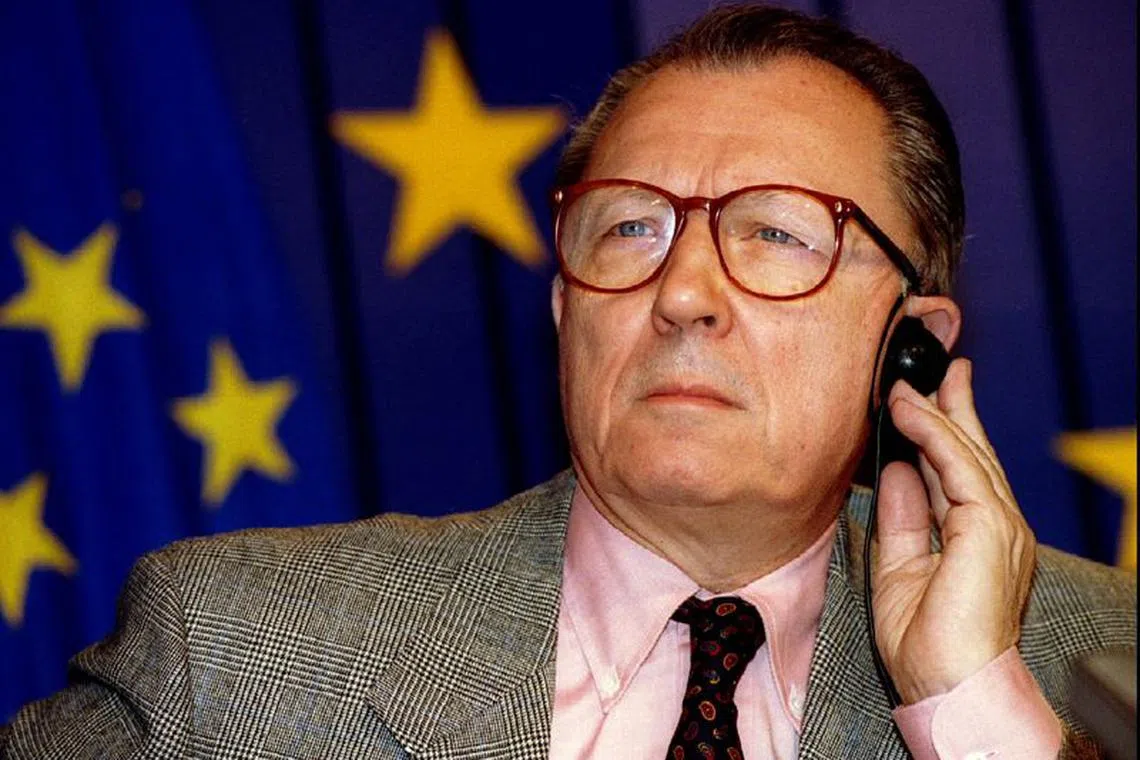 FILE PHOTO: European Union President Jacques Delors listens to a question during a press conference on the book \"In search of Europe\" October 21, 1994, at the EU headquarters. REUTERS/Nathalie Koulischer/File Photo