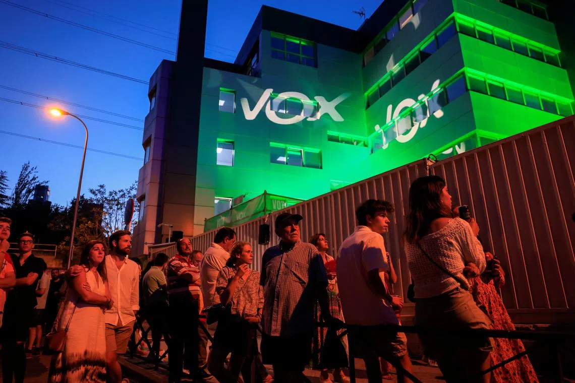 FILE PHOTO: Supporters of Spain's far-right Vox party leader Santiago Abascal await the election results, outside the Vox party headquarters, on the day of the general election, in Madrid, Spain, July 23, 2023. REUTERS/Vincent West/File Photo