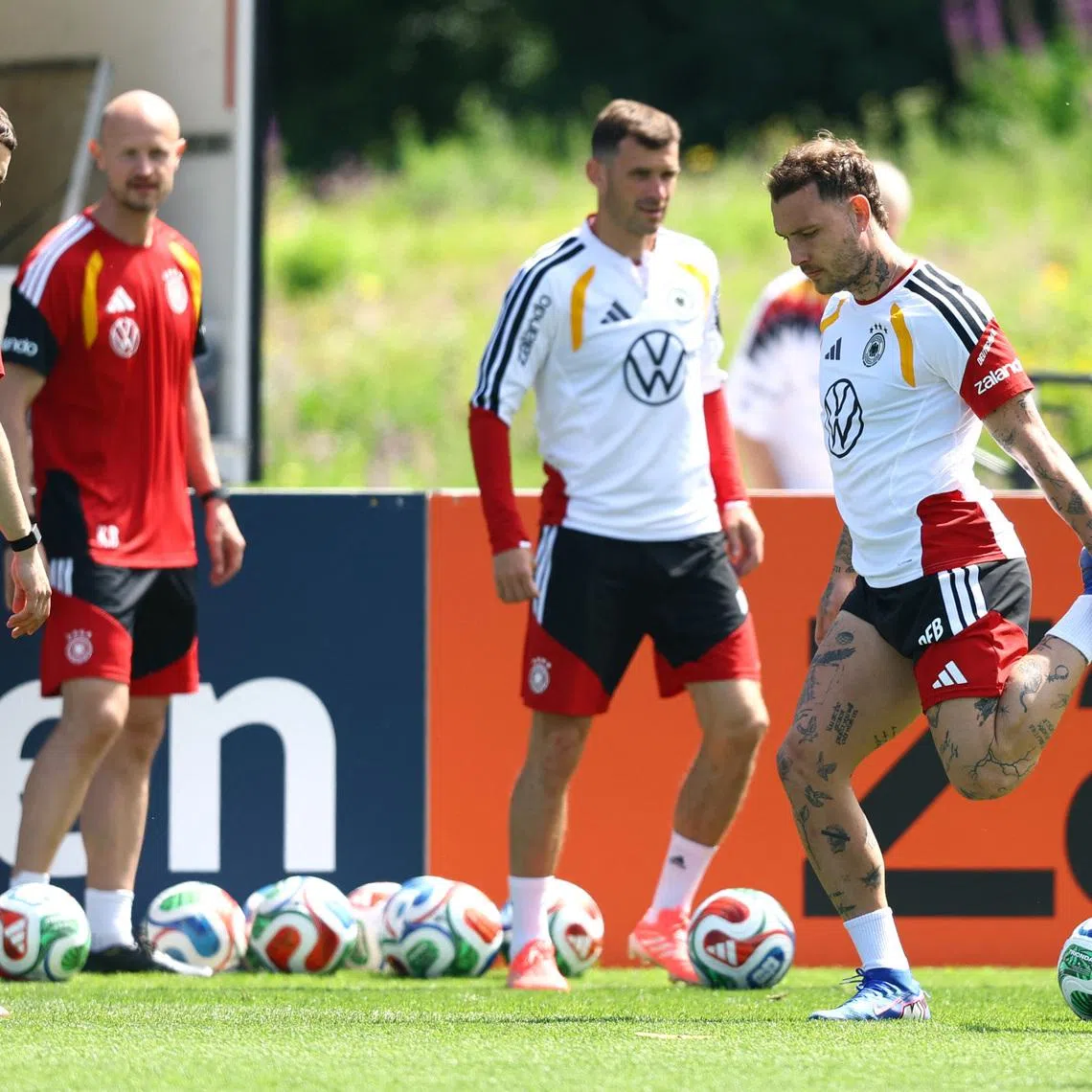 Soccer Football - FIFA World Cup 2026 - Germany Training - Adidas campus, Herzogenaurach, Germany - May 30, 2026 Germany's David Raum and Florian Wirtz in action during training REUTERS/Kai Pfaffenbach