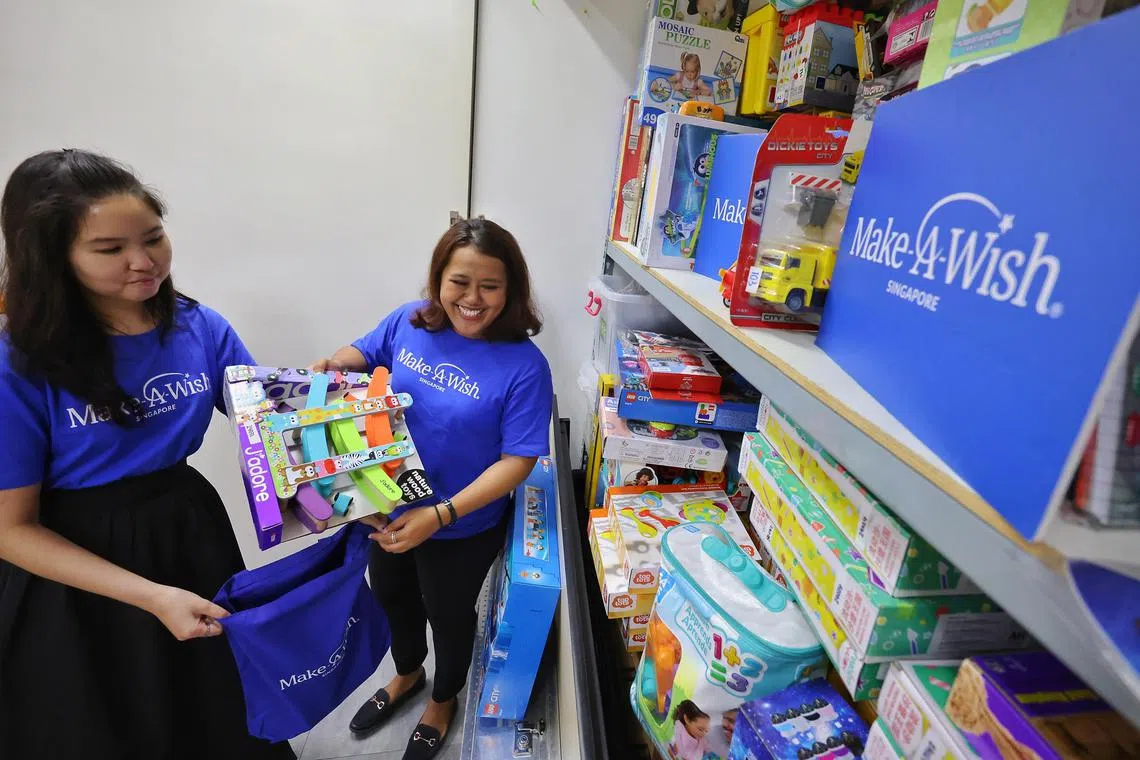 Volunteers taking board games from Make-A-Wish Singapore to break the ice at meetings with children in 2024.