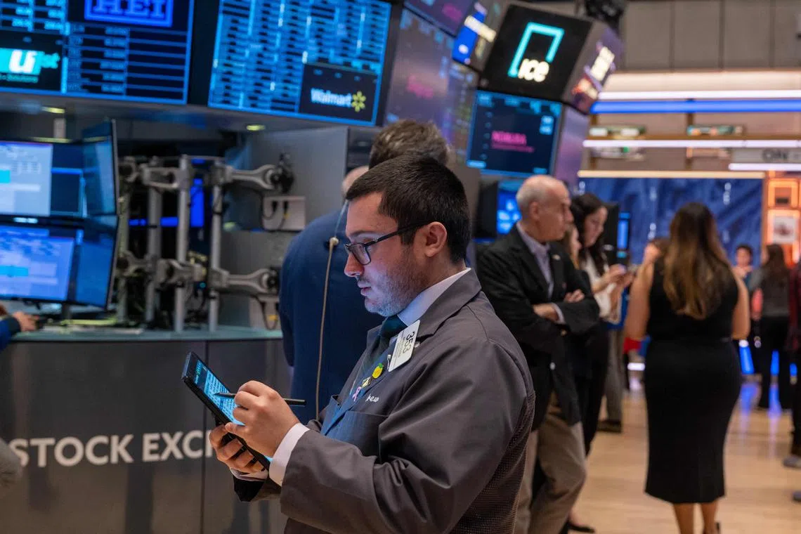 Traders work on the floor of the New York Stock Exchange, in New York City. 