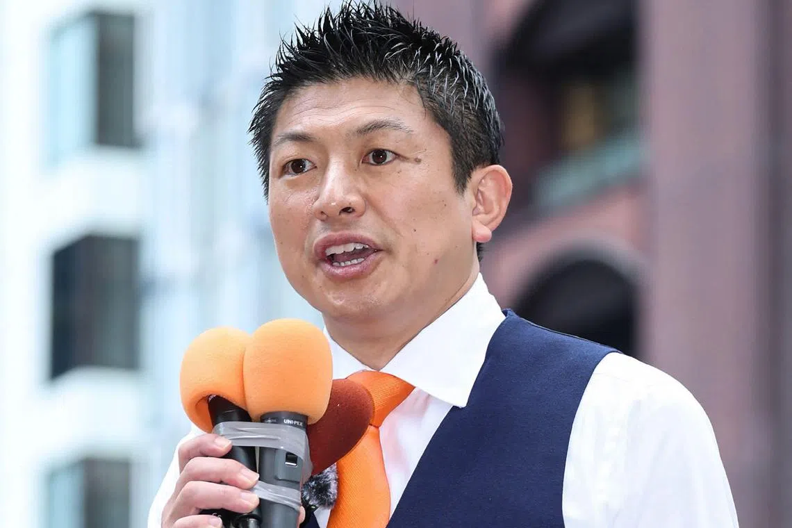 (FILES) This file photo taken on July 3, 2025 shows Sanseito Party secretary general Sohei Kamiya delivering a campaign speech ahead of the July 20 upper house elections in the town of Kunitomi, Miyazaki prefecture. The head of the populist Sanseito party enjoying growing suppost in Japan denied ties to Russia, after one of its candidate for the July 20 national elections gave Moscow's state-run media Sputnik an interview. Asked if the party has any special ties with Russia, Sanseito head Sohei Kamiya told an internet news programme on July 15, 2025 that "we don't. Not at all". (Photo by JIJI Press / AFP) / Japan OUT