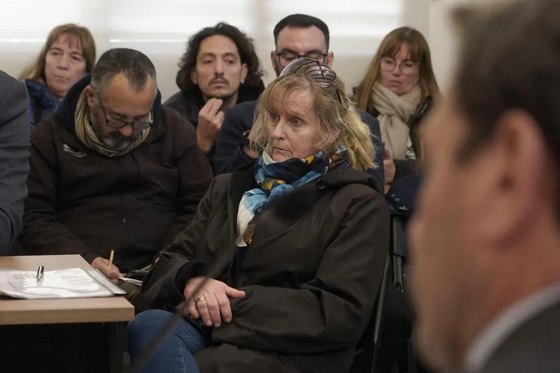 Patricia Kadgien (centre) - daughter of World War II Nazi Friedrich Kadgien - attending a Sept 4 hearing, following her arrest.