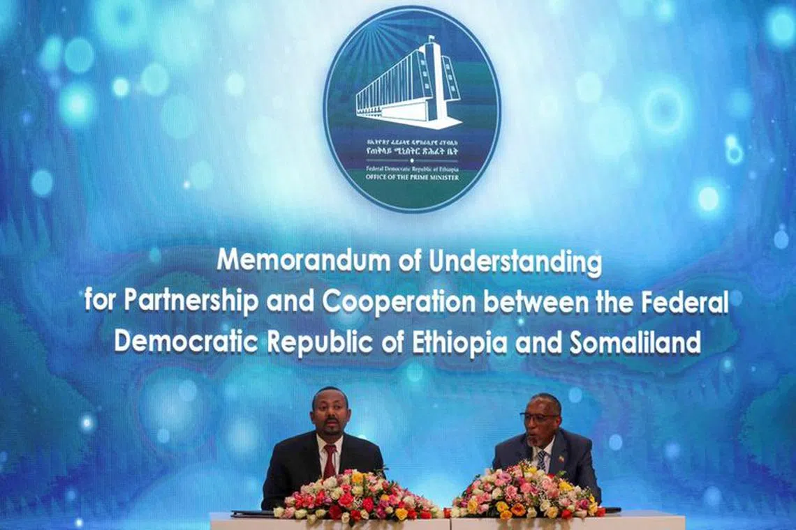 Somaliland President Muse Bihi Abdi and Ethiopia’s Prime Minister Abiy Ahmed attend the signing of the Memorandum of Understanding agreement, that allows Ethiopia to use a Somaliland port, in Addis Ababa, Ethiopia, January 1, 2024. REUTERS/Tiksa Negeri