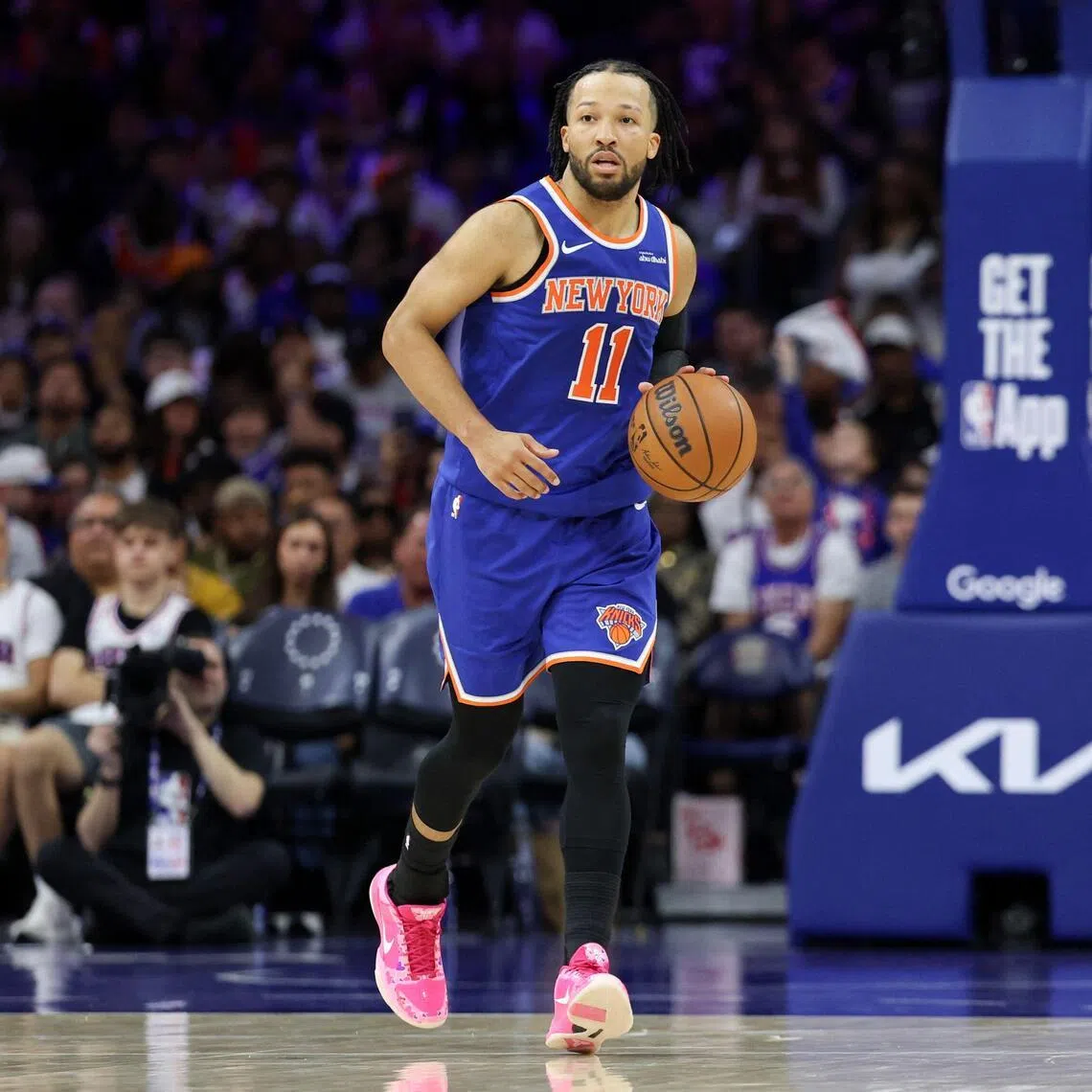 Jalen Brunson of the New York Knicks dribbles the ball up the court against the Philadelphia 76ers during the third quarter in Game 4 of the second round of the NBA play-offs.