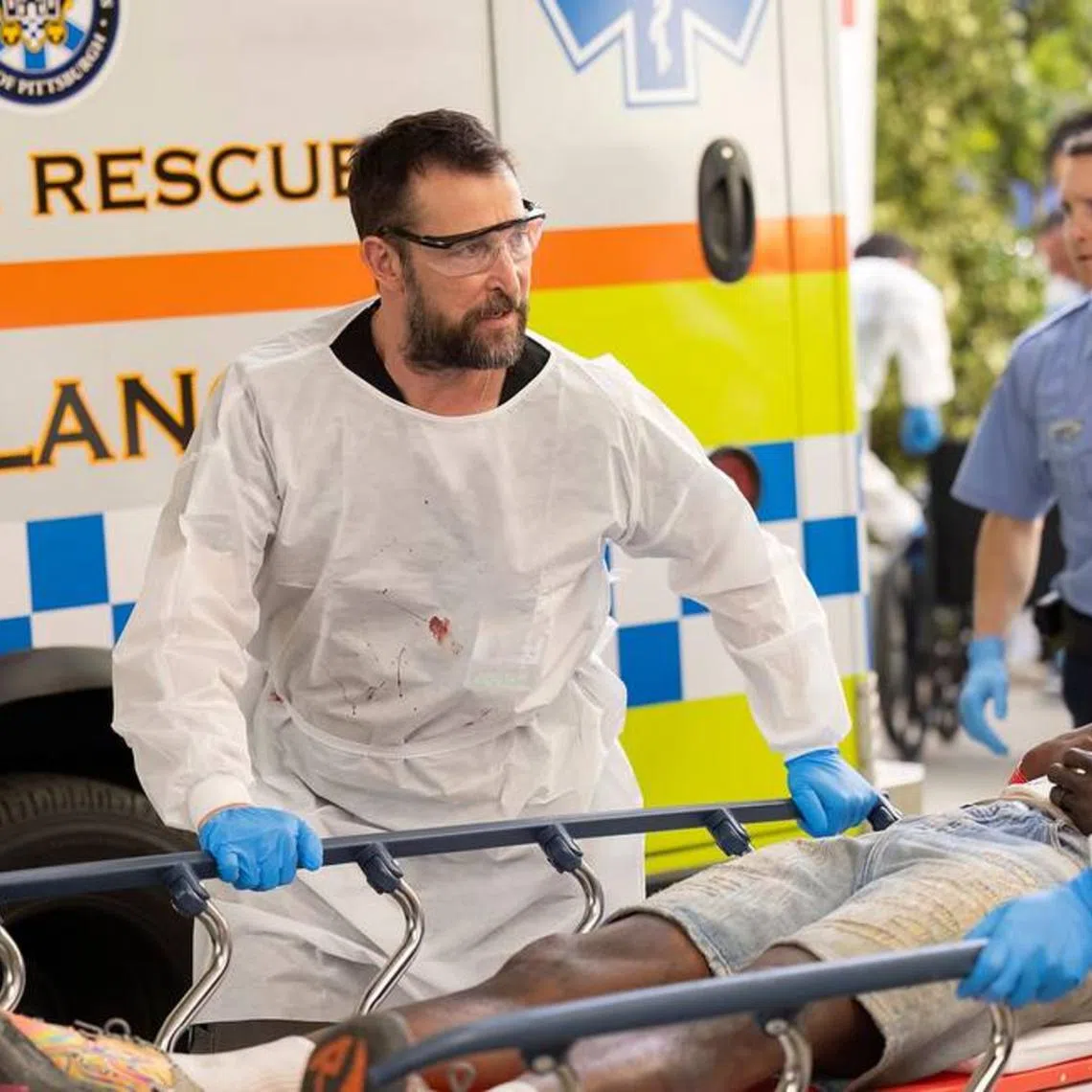 Noah Wyle plays an emergency department attending in gritty medical drama The Pitt.