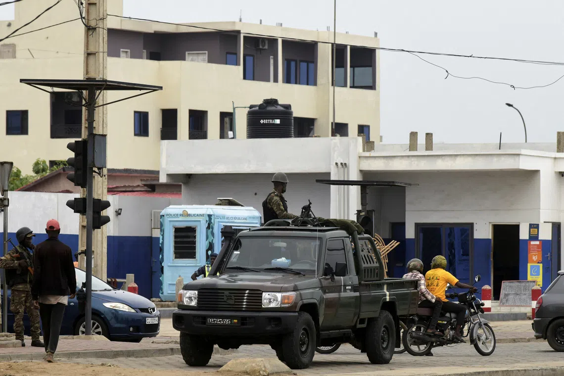 A military vehicle takes position in a street, a day after the country's armed forces thwarted the attempted coup against the government of Benin's President Patrice Talon, in Cotonou, Benin, December 8, 2025. REUTERS/Charles Placide Tossou
