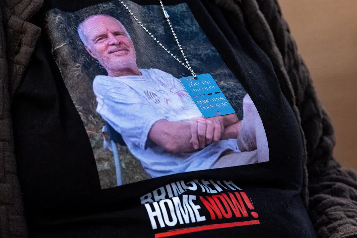 The wife of Hamas hostage Keith Siegel wears a T-shirt bearing his image. Mrs Aviva Siegel was released by Hamas during a truce in November 2023.