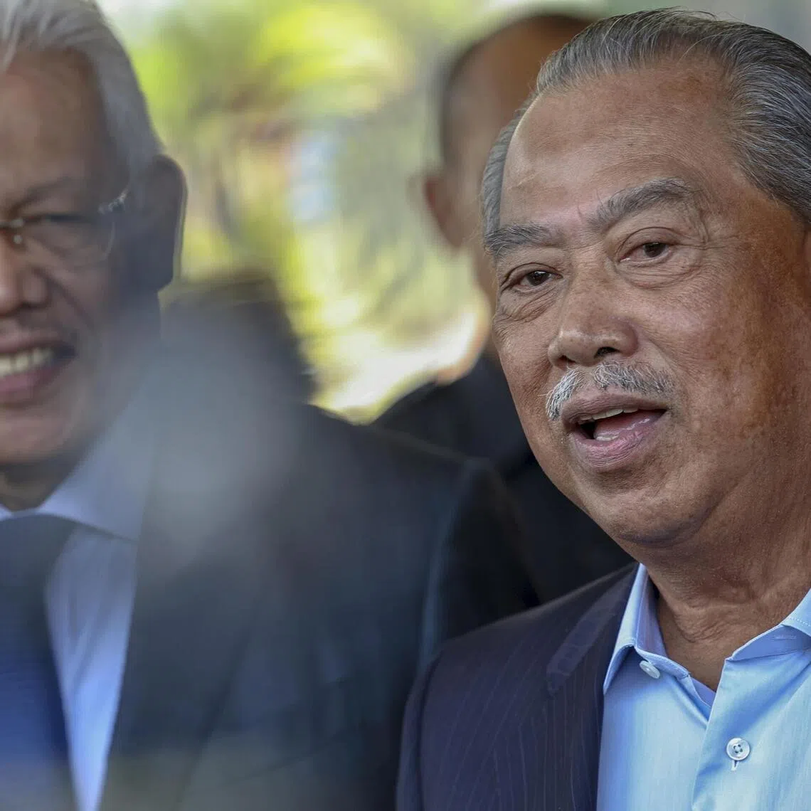 Bersatu president Muhyiddin Yassin and his former deputy Hamzah Zainuddin (left), who was sacked from the party.