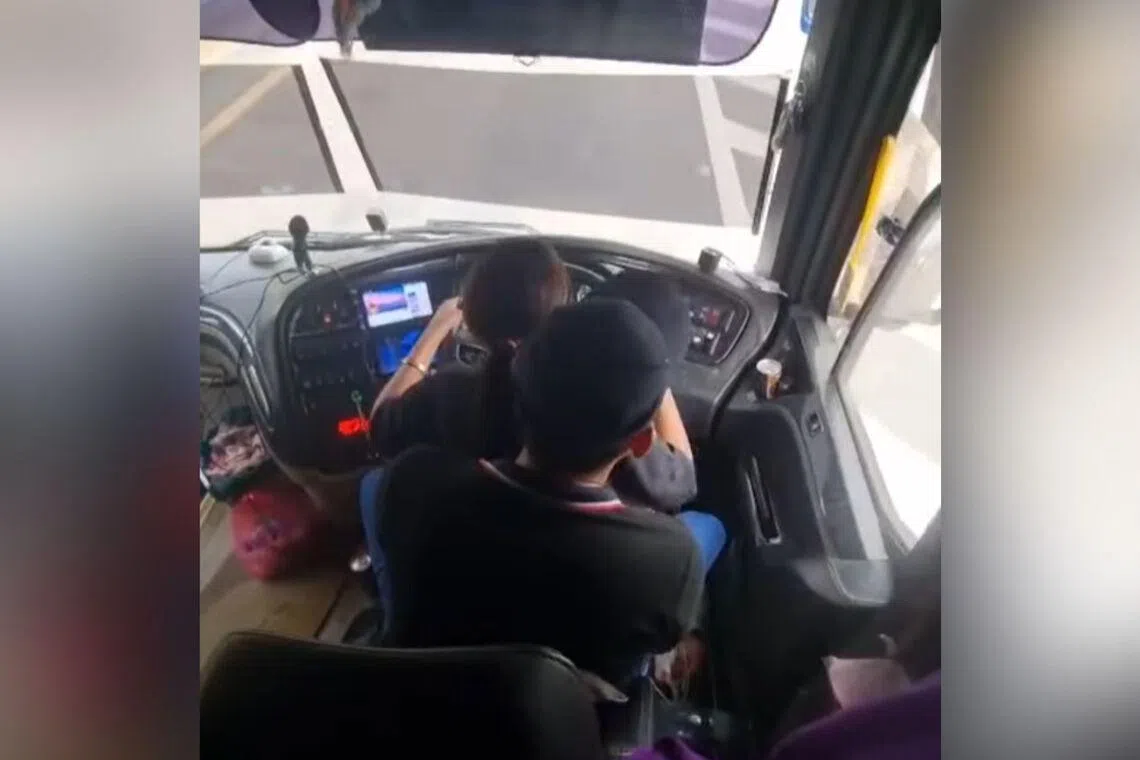Express bus driver in Malaysia probed after clip of woman seated on his lap as he drove goes viral