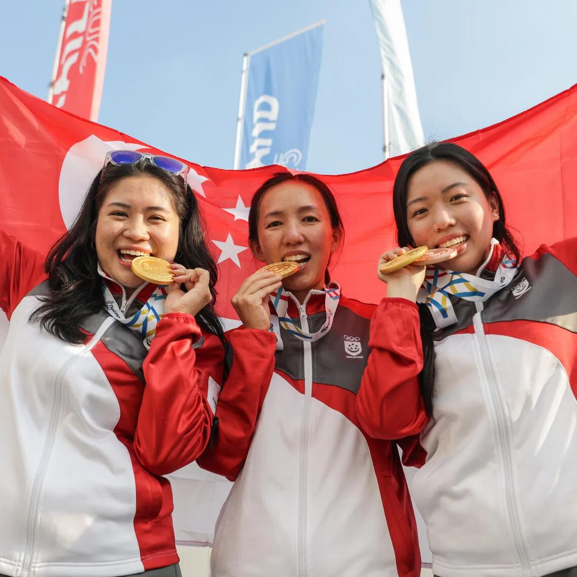 (From left) Martina Amos, Jasmine Ser and Adele Tan posing with their medals after winning gold in the 50m air rifle 3-position team event.