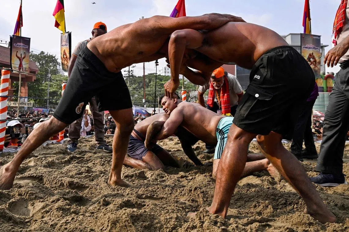 Wrestlers competing during the Jabbar's Boli Khela, a traditional wrestling competition in Chittagong, Bangladesh on April 25, 2026. 