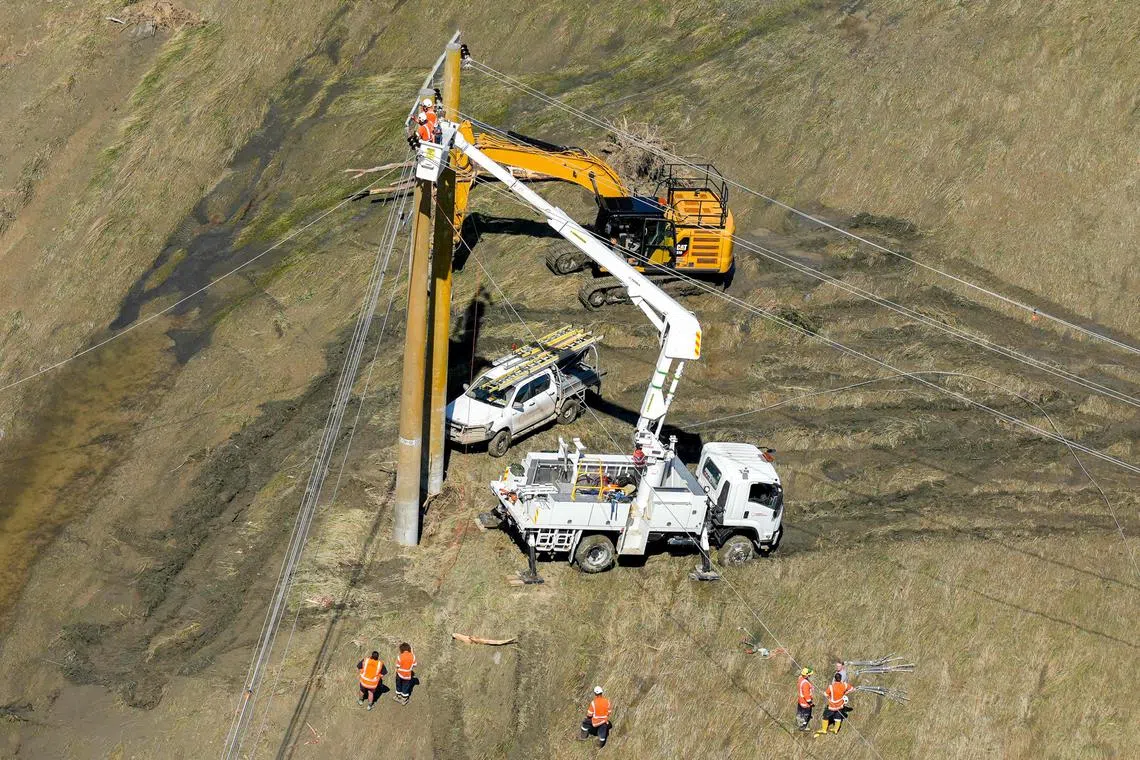 Crews repair powerlines that have been damaged by Cyclone Gabrielle near Napier on Feb 18.