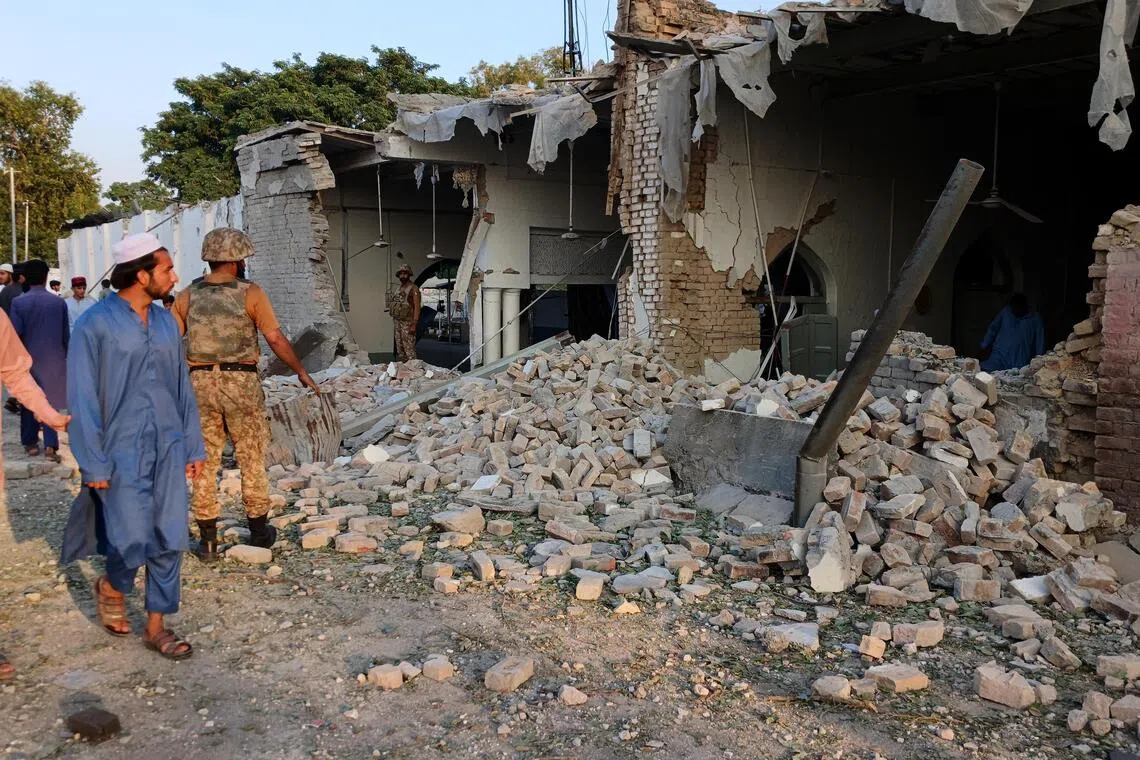 Death toll from attack at police HQ in Pakistan rises to 31