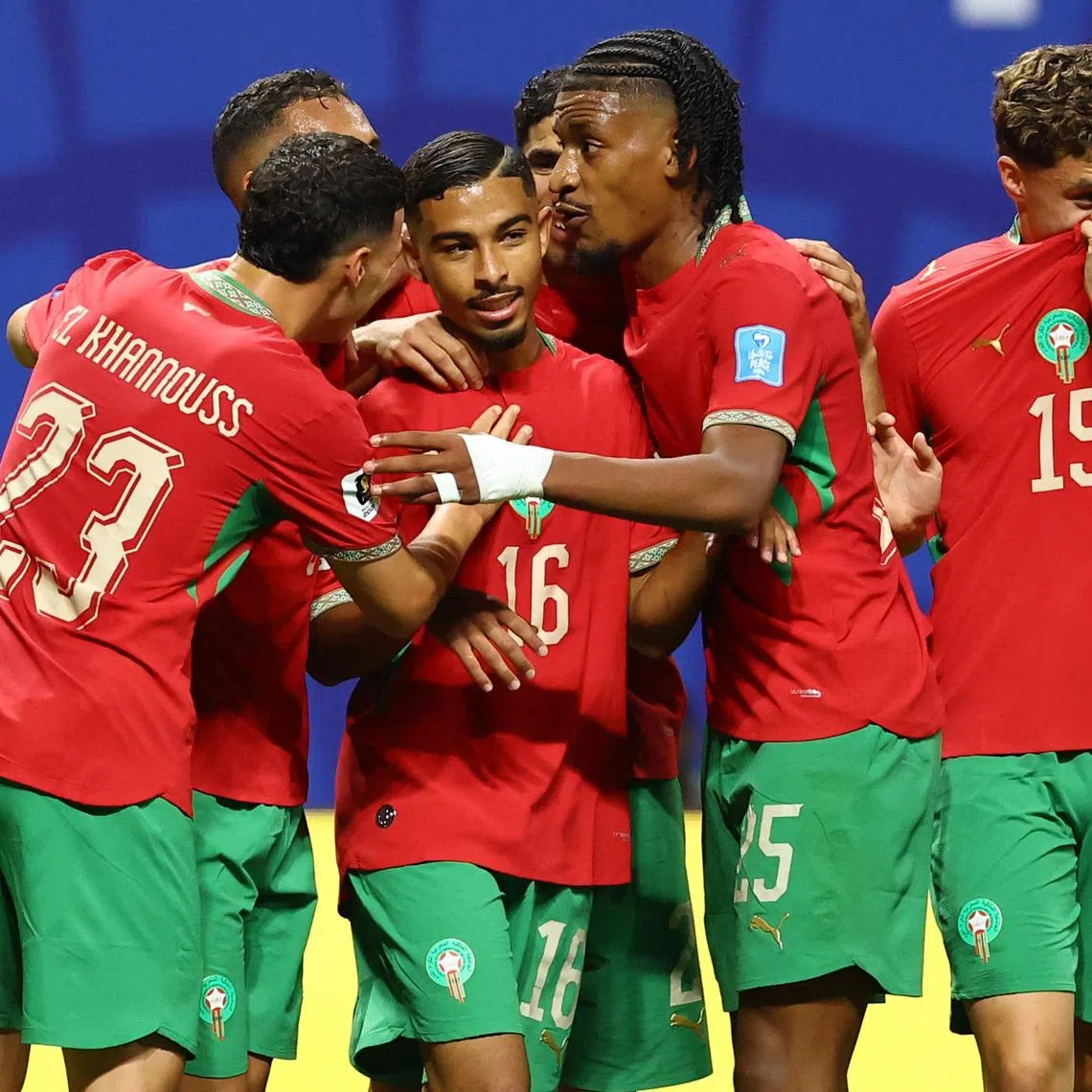 Morocco’s Gessime Yassine celebrates scoring their fourth goal against Haiti with his teammates on June 25.
