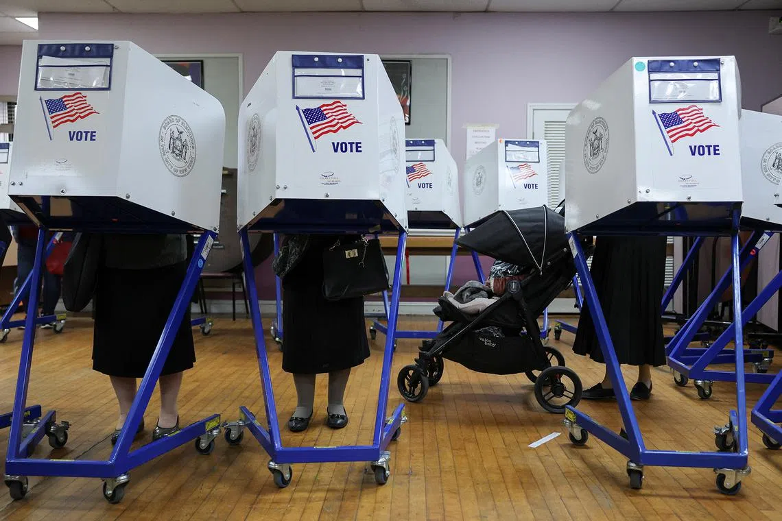 Women from the Hasidic Jewish community voting at a polling center on Election Day in the Brooklyn borough of New York City, U.S., Nov 5, 2024. 