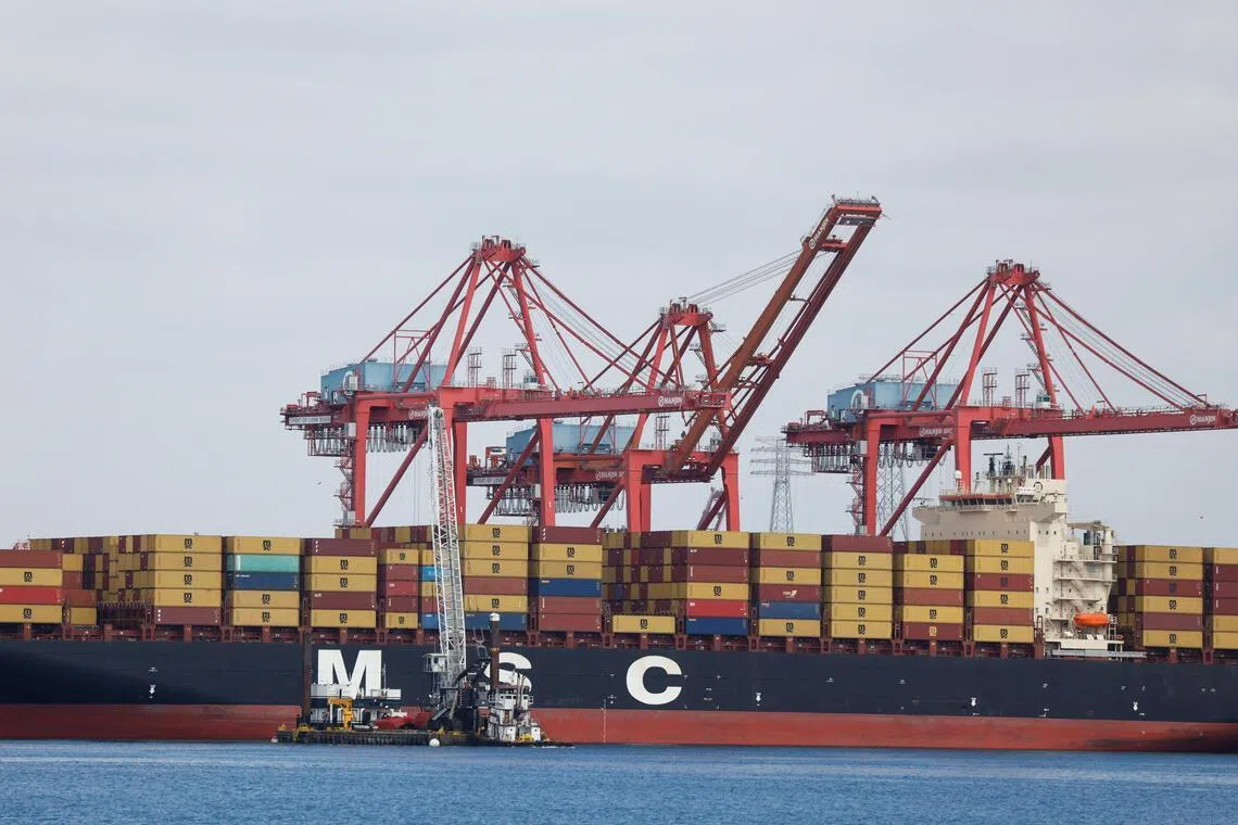 Shipping containers sit on a Mediterranean Shipping Company vessel docked at the port of Los Angeles in Long Beach, California, on March 10, 2026.