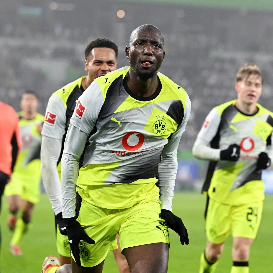 Soccer Football - Bundesliga - VfL Wolfsburg v Borussia Dortmund - Volkswagen Arena, Wolfsburg, Germany - February 7, 2026 Borussia Dortmund's Serhou Guirassy celebrates scoring their second goal with Felix Nmecha REUTERS/Carmen Jaspersen