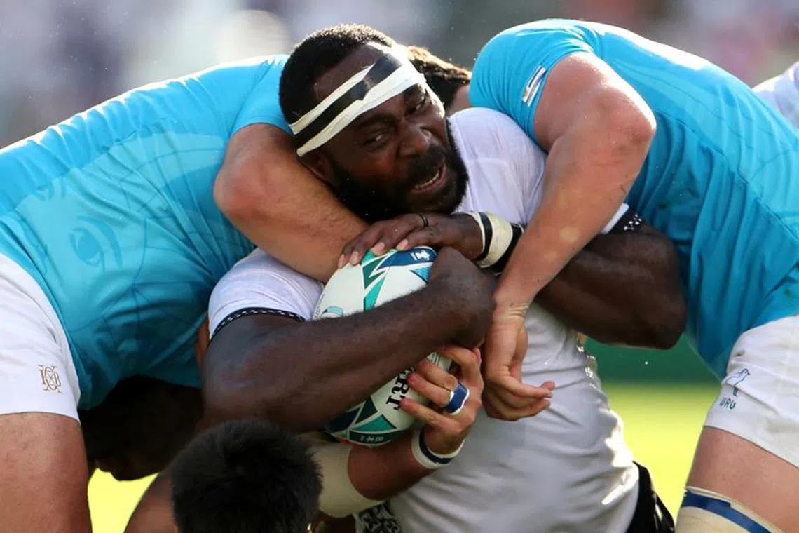 FILE PHOTO: Rugby Union - Rugby World Cup 2019 - Pool D - Fiji v Uruguay - Kamaishi Recovery Memorial Stadium, Kamaishi, Japan - September 25, 2019  Fiji's Api Ratuniyarawa is tackled REUTERS/Peter Cziborra/File Photo