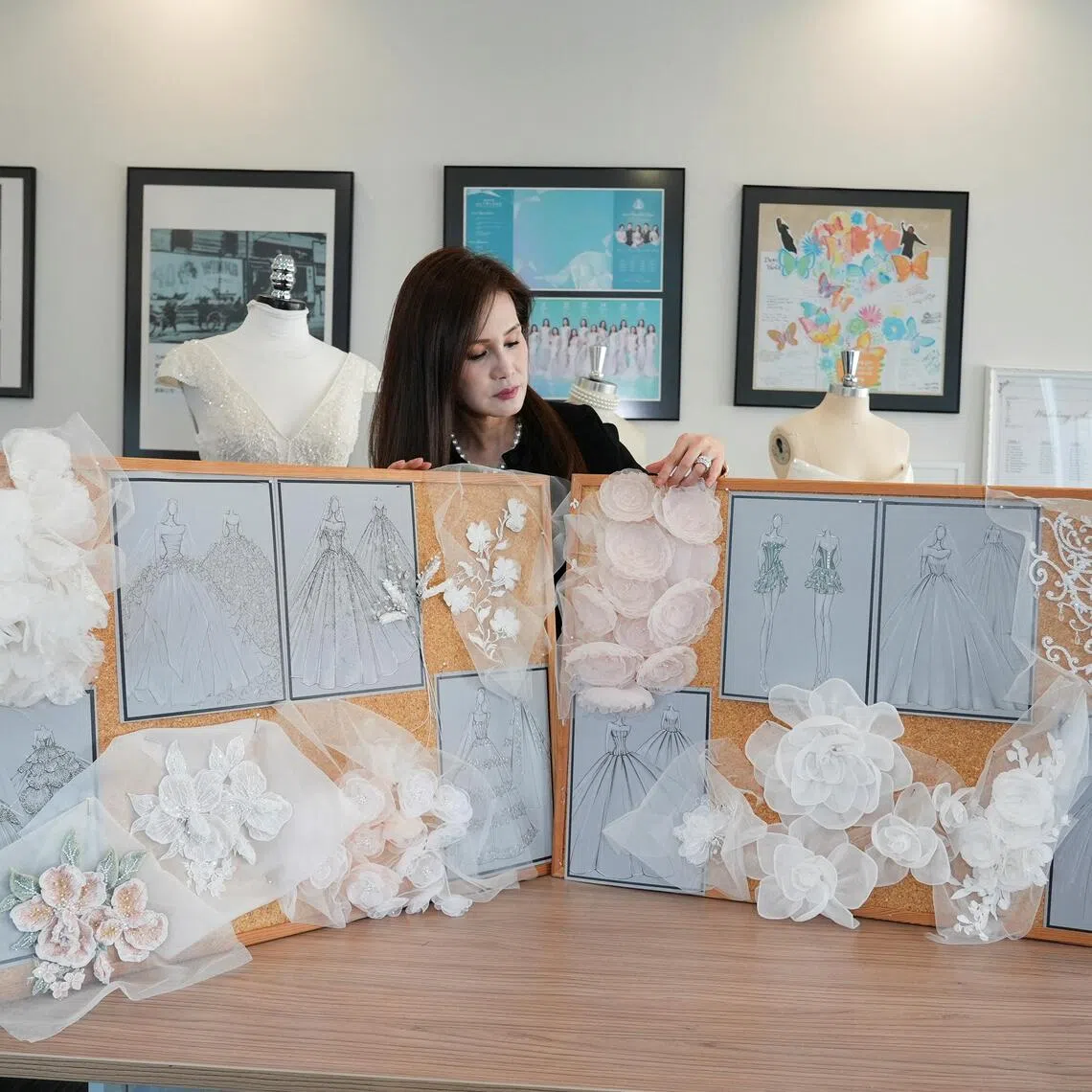 Head of Couture and Design at David's Bridal, Viola Chan, shows wedding dress looks based on Taylor Swift's likely aesthetics in Hong Kong, August 10, 2026.  REUTERS/Joyce Zhou