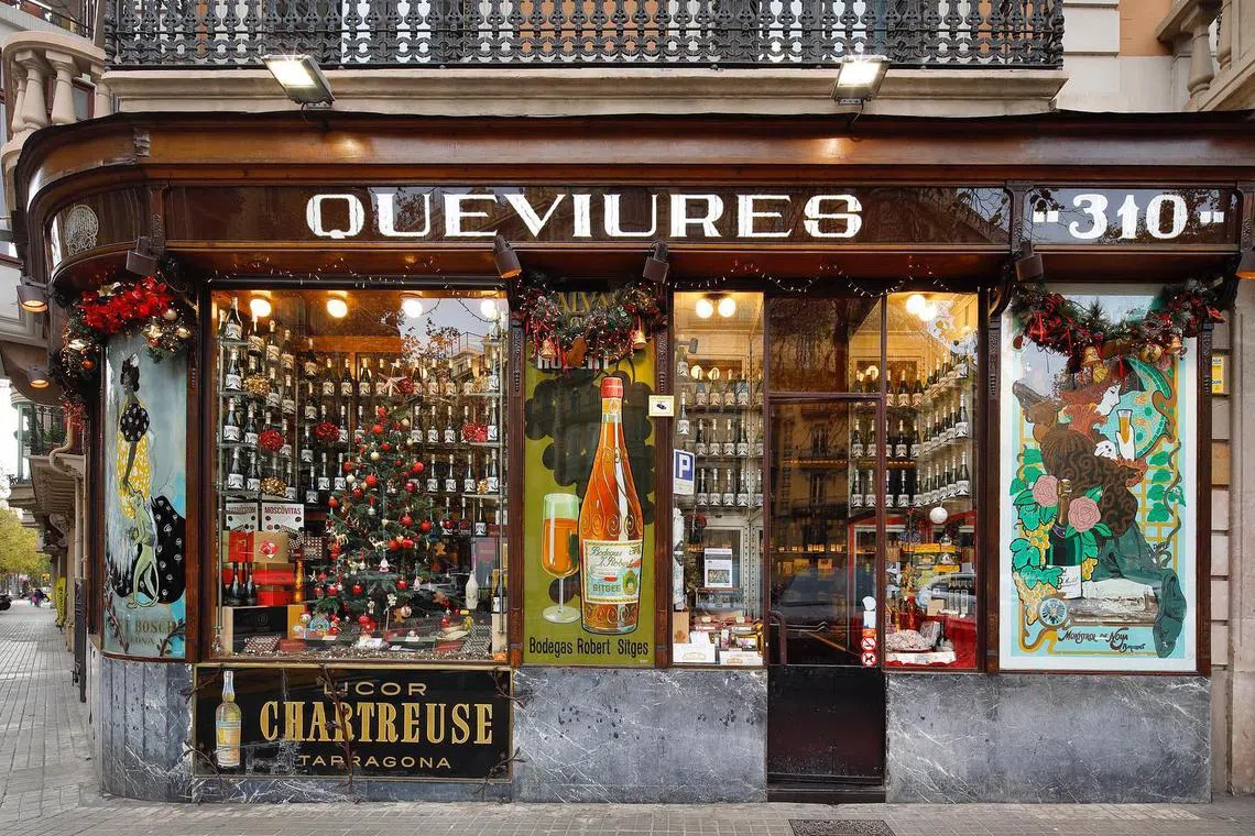 The management of the 125-year old Queviures Murria in Barcelona put up a sign with the €5 charge after getting frustrated with tourists crowding the store.