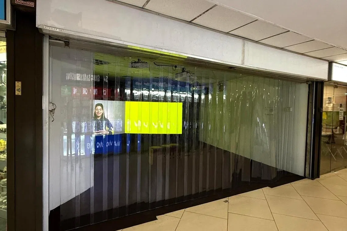 One of three shop units at Lucky Plaza housing Singapore Biennale works. 