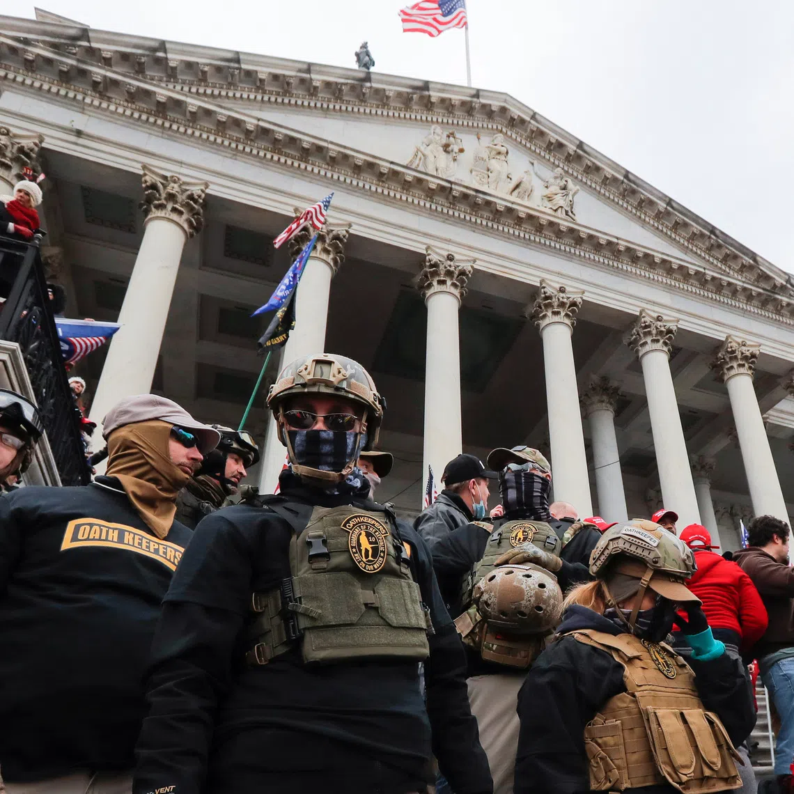 Members of the Oath Keepers militia group stand among supporters of US President Donald Trump at the US Capitol on Jan 6, 2021.