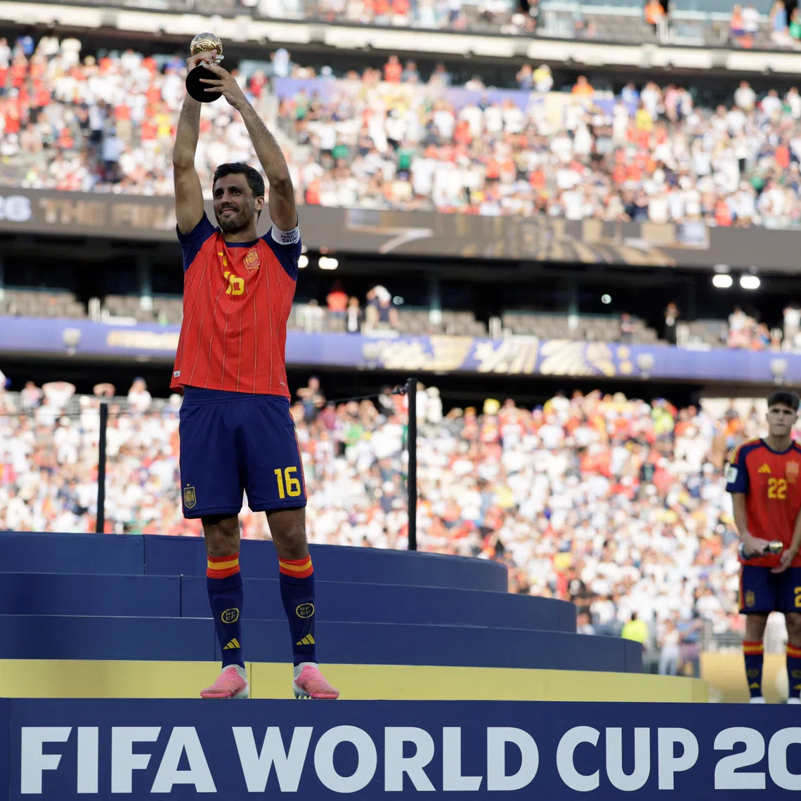 Spain's Rodri celebrates on the podium after winning the Golden Ball following the FIFA World Cup 2026 Final, at New York New Jersey Stadium in East Rutherford, New Jersey, U.S., July 19, 2026. REUTERS/Evan Vucci