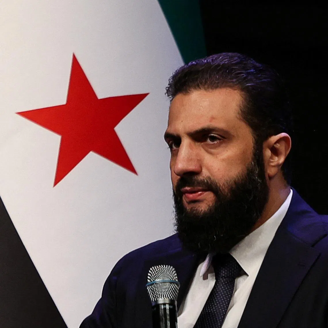 FILE PHOTO: Syrian President Ahmed al-Sharaa attends the Ministry of Awqaf conference titled \"Unity of Islamic Discourse\" at the Conference Palace in Damascus, Syria, February 16, 2026. REUTERS/Khalil Ashawi/ File Photo