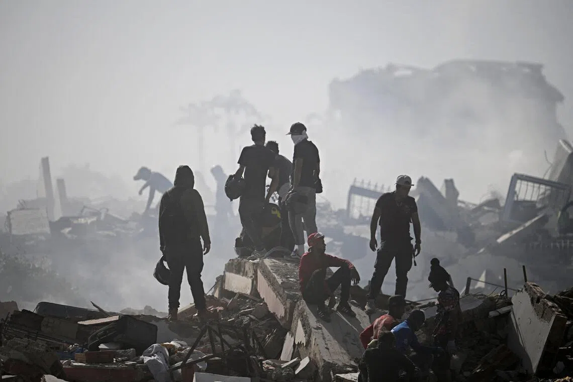 Volunteers comb through the rubble of a collapsed building in La Guaira state, some 40km north-east of Venezuela’s capital Caracas.
