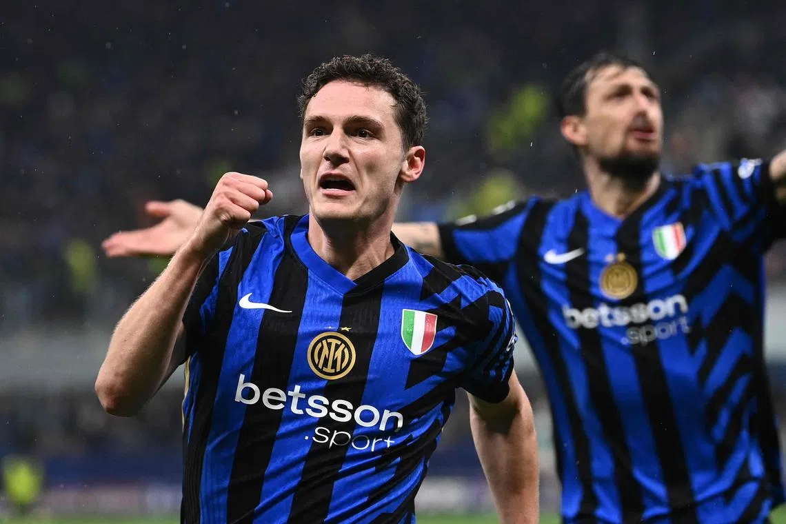 Inter Milan's French defender Benjamin Pavard celebrates scoring his team's second goal against Bayern Munich in the Champions League.