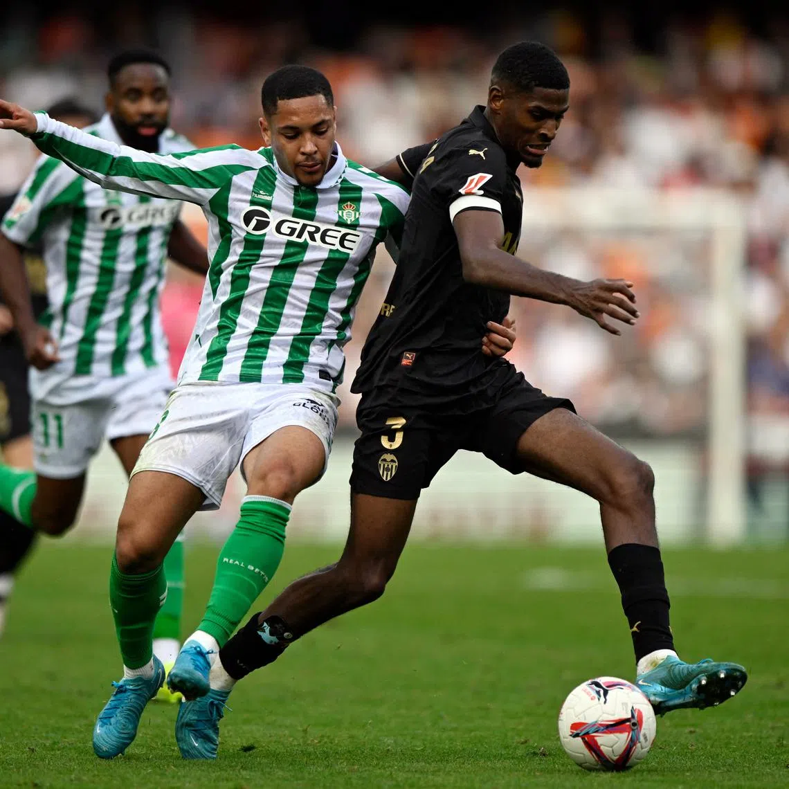 Valencia's Cristhian Mosquera (right) in action with  Vitor Roque of Real Betis.