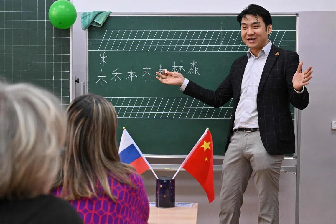 The ChineseFirst language centre co-founder Wang Yinyu teaches a Chinese class for adults in the town of Reutov, outside Moscow, on Friday.  