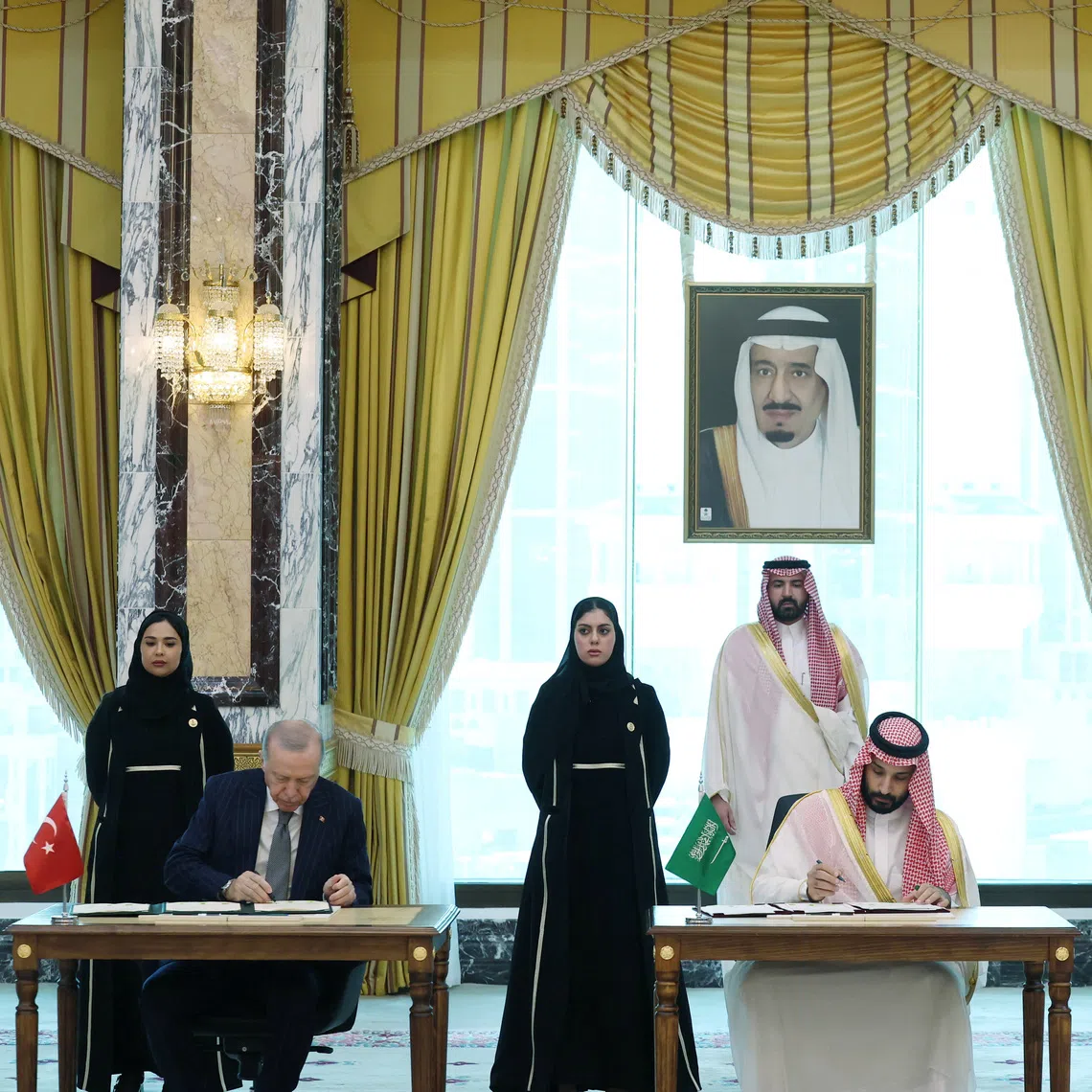 Turkish President Tayyip Erdogan, Saudi Crown Prince Mohammed bin Salman and Pakistan's Prime Minister Shehbaz Sharif sign a joint defense agreement in Mecca, Saudi Arabia, on Aug 7.