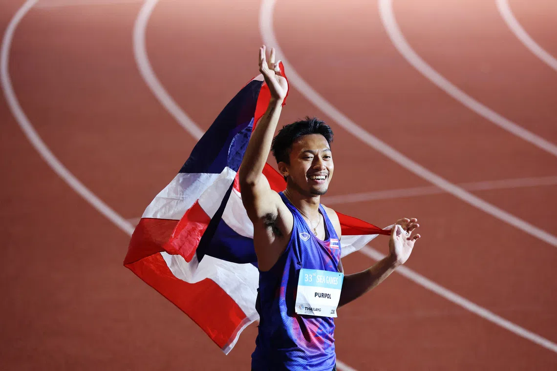 Southeast Asian Games - SEA - Athletics - Suphachalasai National Stadium, Bangkok, Thailand - December 13, 2025 Thailand's Puripol Boonson celebrates after winning the men's 200m final REUTERS/Patipat Janthong