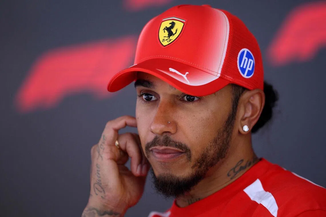 Ferrari’s British driver Lewis Hamilton talks to the media in the paddock of the Spa-Francorchamps circuit.
