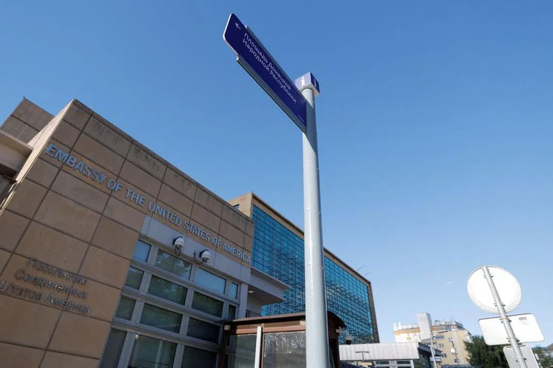 FILE PHOTO: A newly installed direction sign \"Donetsk People's Republic Square\" is seen in front of the U.S. embassy in Moscow, Russia June 22, 2022. REUTERS/Maxim Shemetov/File Photo