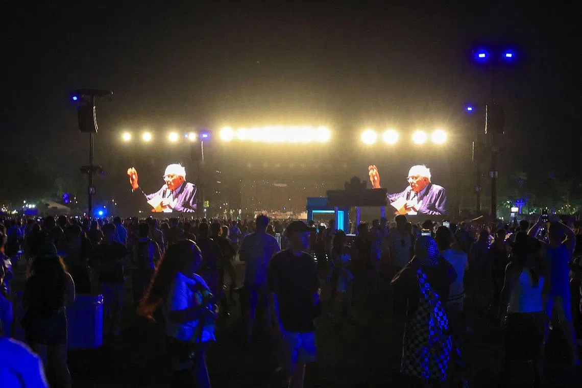 US Senator Bernie Sanders, Independent from Vermont, is seen on giant screens as he speaks on stage during the 2025 Coachella Valley Music and Arts Festival at Empire Polo Club on April 12.