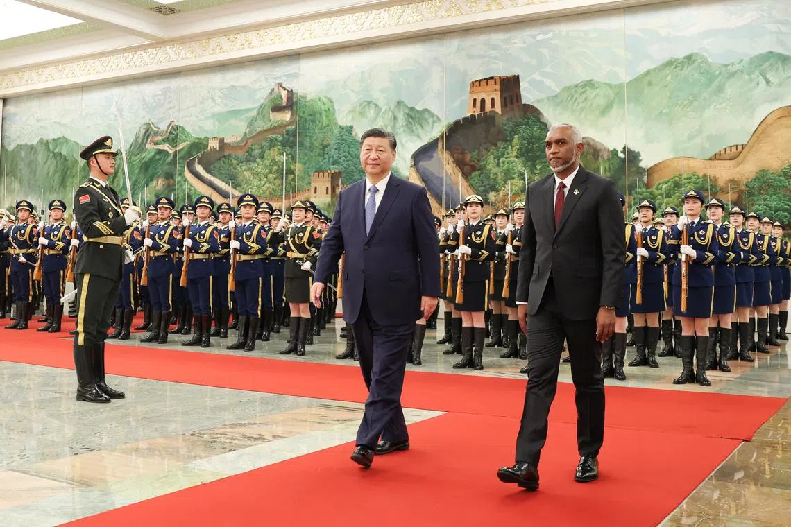 FILE PHOTO: Chinese President Xi Jinping and Maldivian President Mohamed Muizzu attend a welcome ceremony at the Great Hall of the People in Beijing, China January 10, 2024. cnsphoto via REUTERS /File Photo