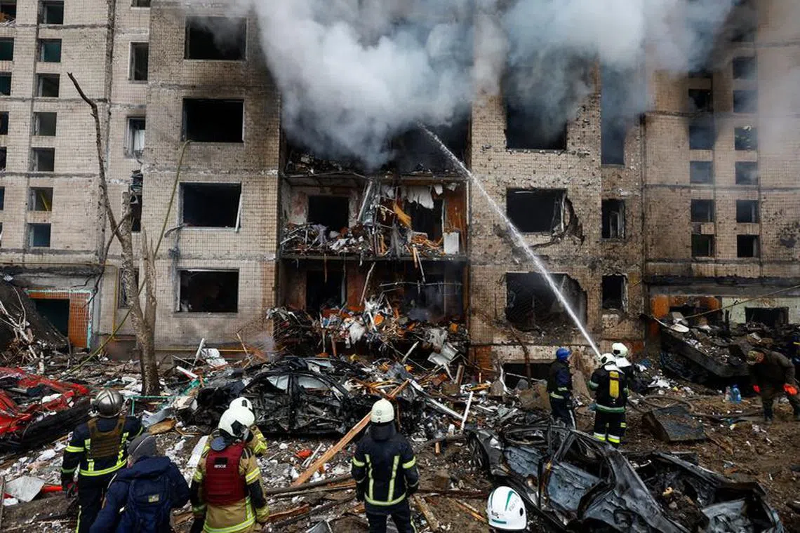 Firefighters work at a site of a residential building heavily damaged during a Russian missile attack, amid Russia's attack on Ukraine, in Kyiv, Ukraine January 2, 2024. REUTERS/Valentyn Ogirenko