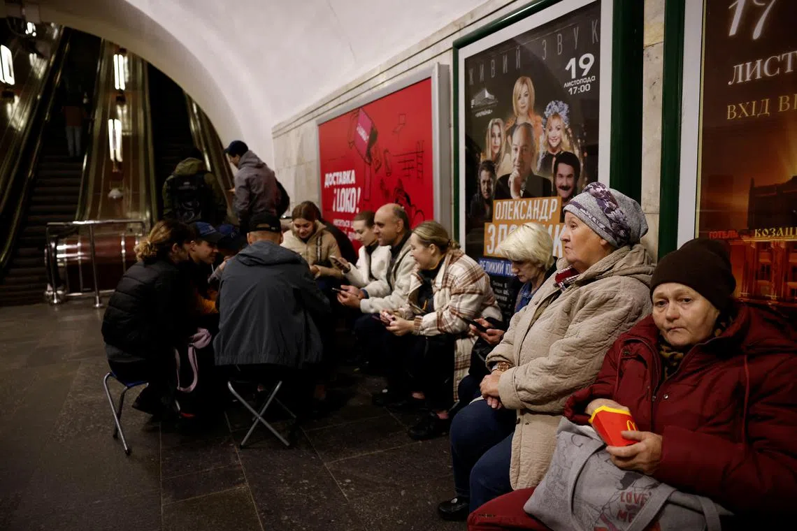 People taking shelters in a metro station during an air raid in Kyiv, Ukraine, on Nov 11.