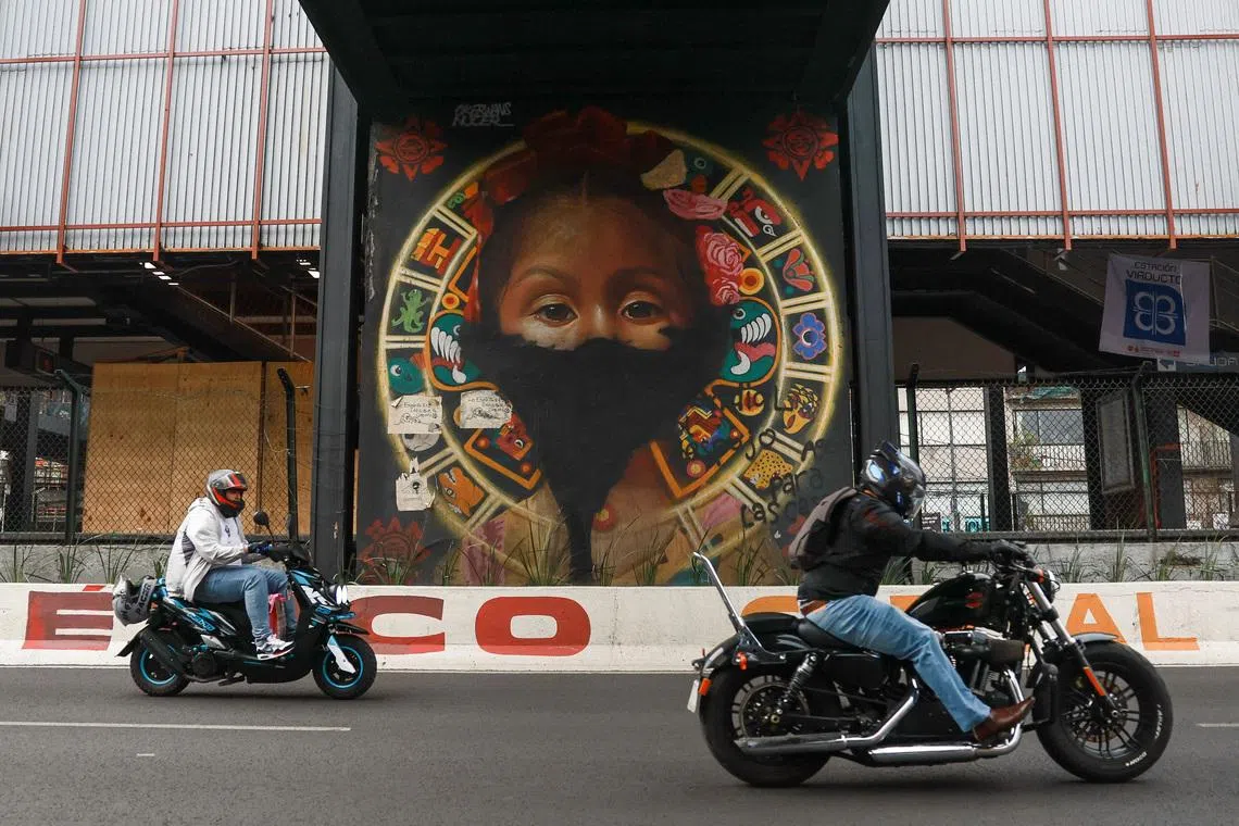 Motorcyclists ride past a subway station where renovation work is underway to upgrade entrances, platforms, and structural elements ahead of the World Cup's opening match on June 11, in Mexico City, Mexico, May 17, 2026. REUTERS/Henry Romero