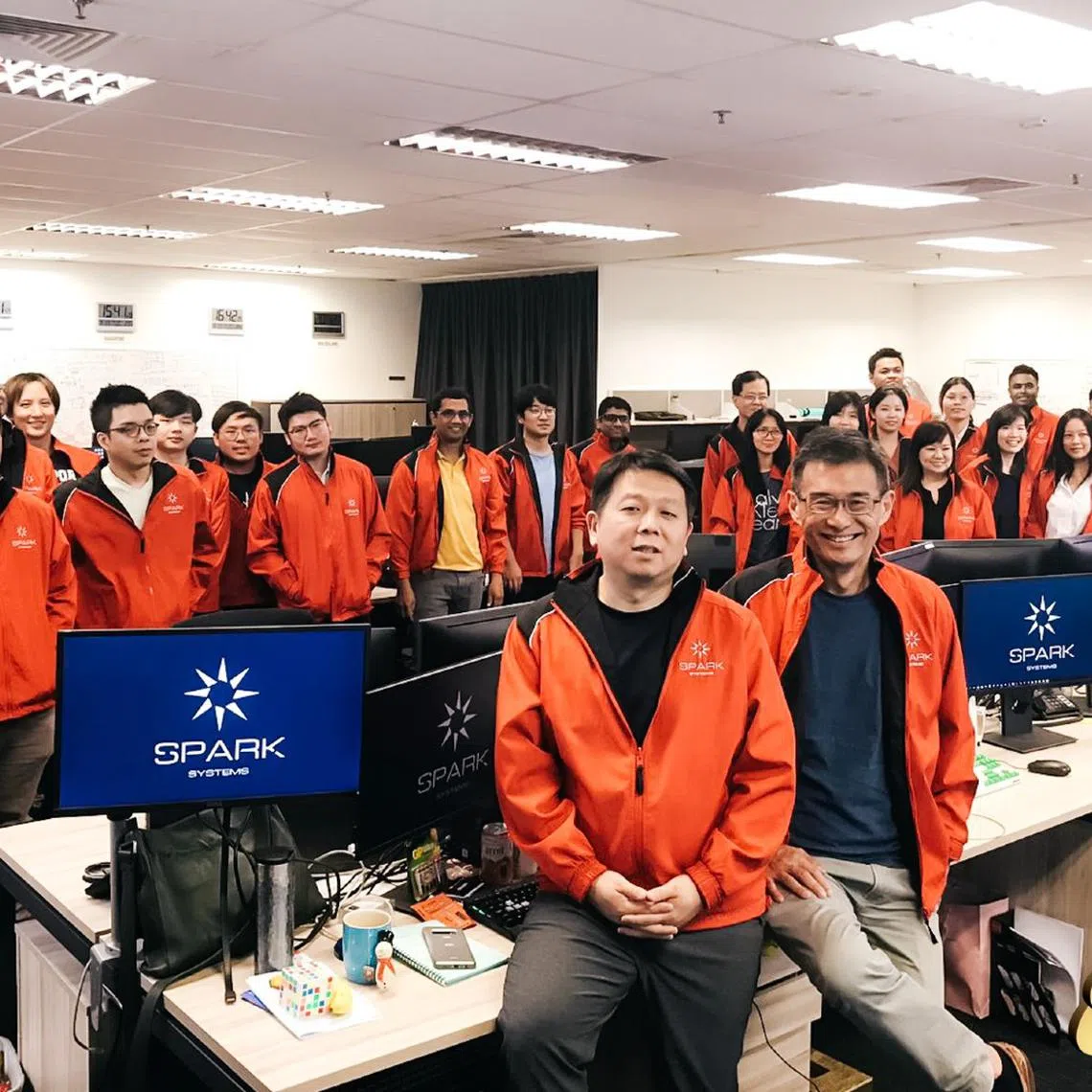 Mr Wong Joo Seng (front row, right) with his team at Spark Systems. 