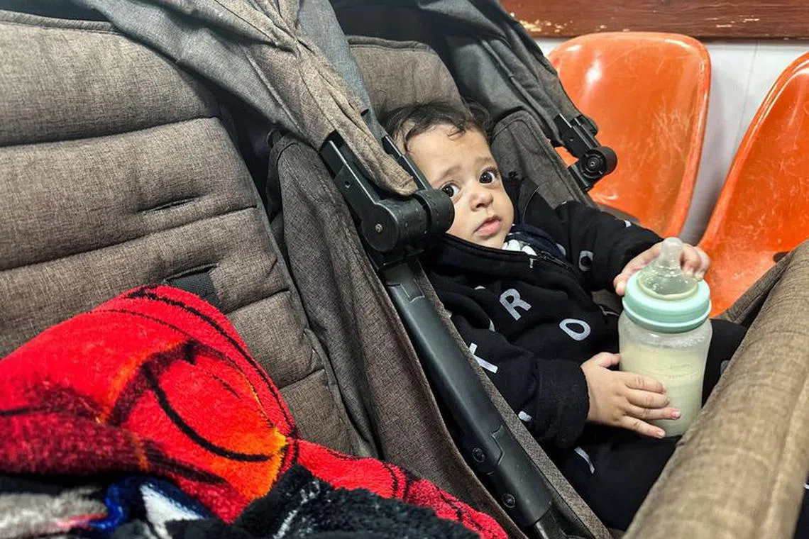 A Palestinian boy, who has a skin infection, looks on at a hospital, amid doctors warning of the spread of diseases and infections among Gazan children due to the ongoing conflict between Israel and Hamas, in Rafah, in the southern Gaza Strip December 12, 2023. REUTERS/Fadi Shana/ File photo