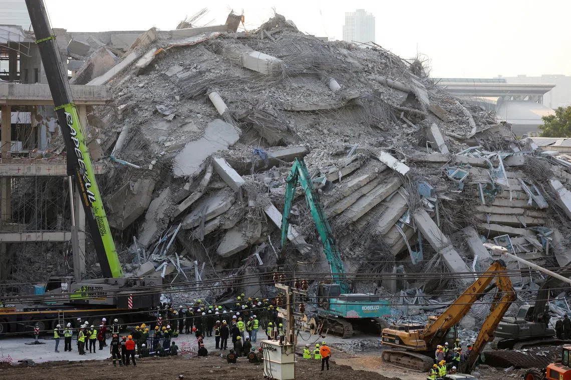 FILE PHOTO: Rescue personnel work at the site of a building that collapsed, following a strong earthquake, in Bangkok, Thailand, March 29, 2025. REUTERS/Patipat Janthong/File Photo