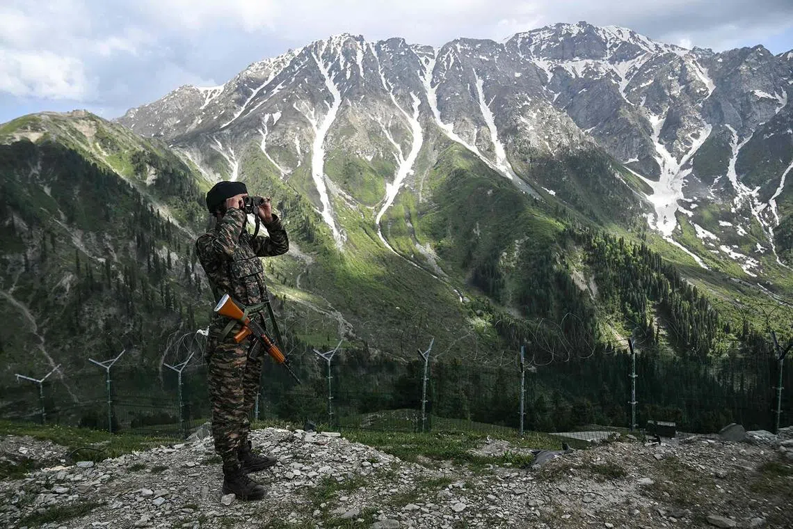 An Indian army soldier standing guard near the Line of Control in India's Kashmir region on May 19, 2025. 