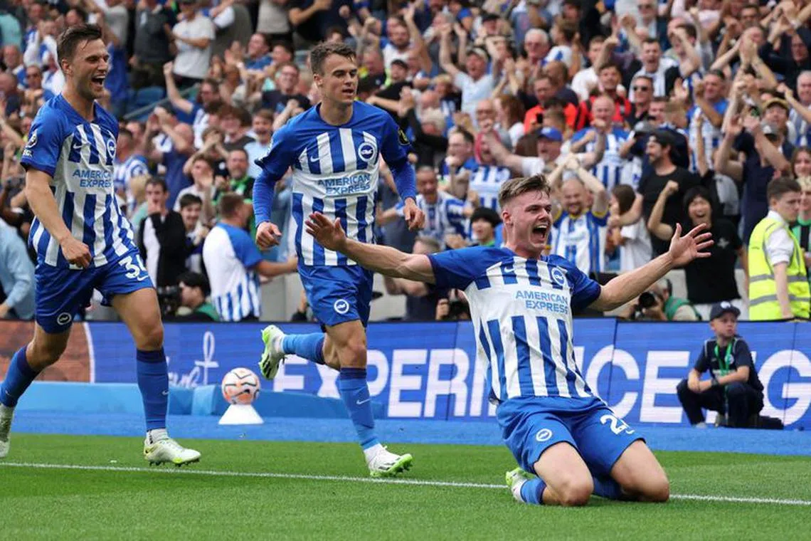 Soccer Football - Premier League - Brighton & Hove Albion v Newcastle United - The American Express Community Stadium, Brighton, Britain - September 2, 2023 Brighton & Hove Albion's Evan Ferguson celebrates scoring their first goal with Solly March and Joel Veltman REUTERS/Ian Walton