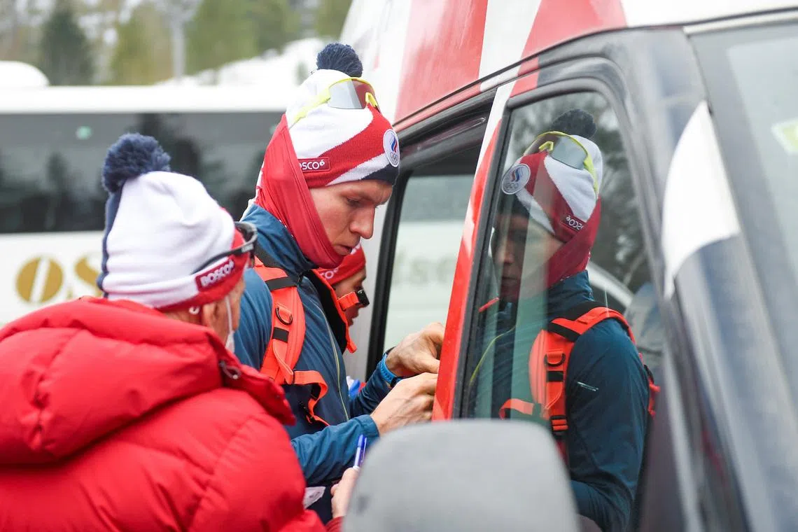 Cross-country skier Aleksandr Bolshunov gets into a car after a training session with the Russian cross-country national team in Holmenkollen, ahead of the upcoming World Cup races in cross-country skiing in Oslo and Drammen, in Oslo, Norway March 1, 2022. Annika Byrde/NTB/via REUTERS
