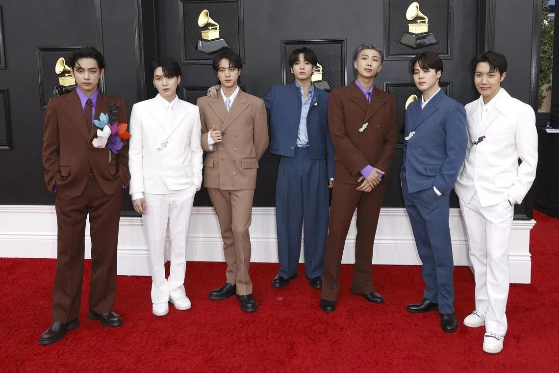 V, Suga, Jin, Jungkook, RM, Jimin and J-Hope of BTS arrive for the 64th annual Grammy Awards at the MGM Grand Garden Arena in Las Vegas, Nevada, USA, April 3, 2022.